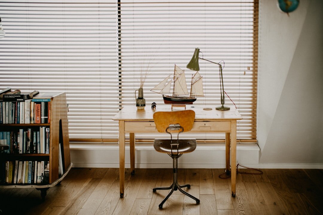 writer at wooden desk with notebook