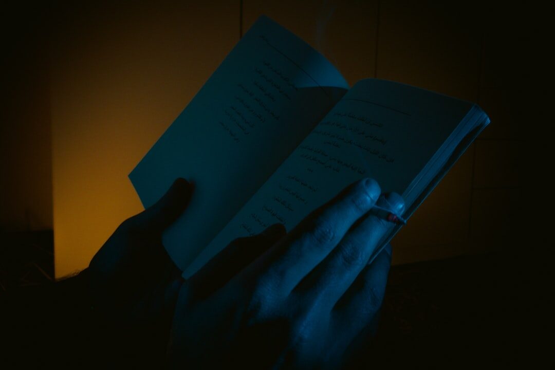 person reading book at night
